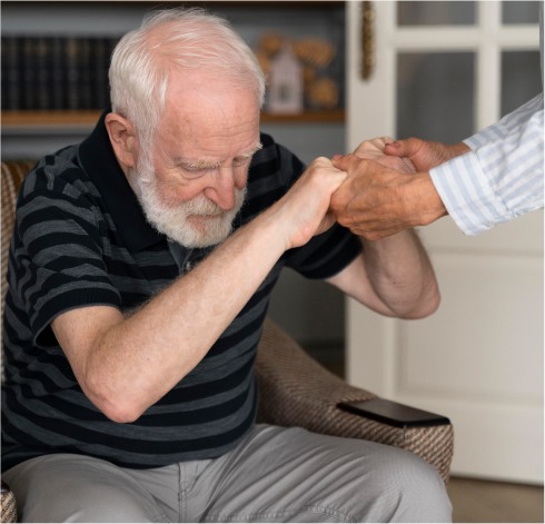 Elderly woman with a caregiver